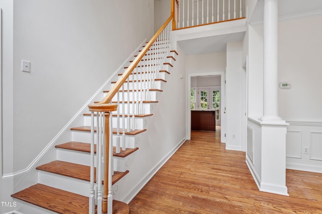 725 Littleleaf Ct, Holly Springs, NC 27540 - stairs featuring wood finished floors and decorative columns
