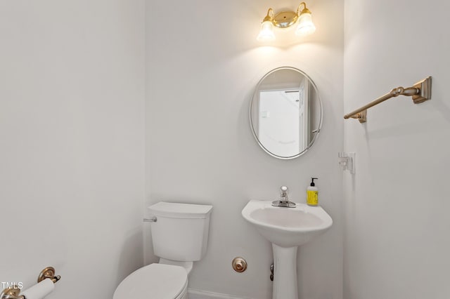 725 Littleleaf Ct, Holly Springs, NC 27540 - bathroom with toilet and baseboards