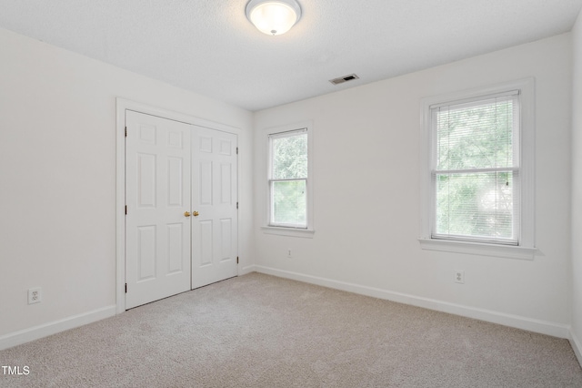 725 Littleleaf Ct, Holly Springs, NC 27540 - unfurnished bedroom with carpet floors and a closet