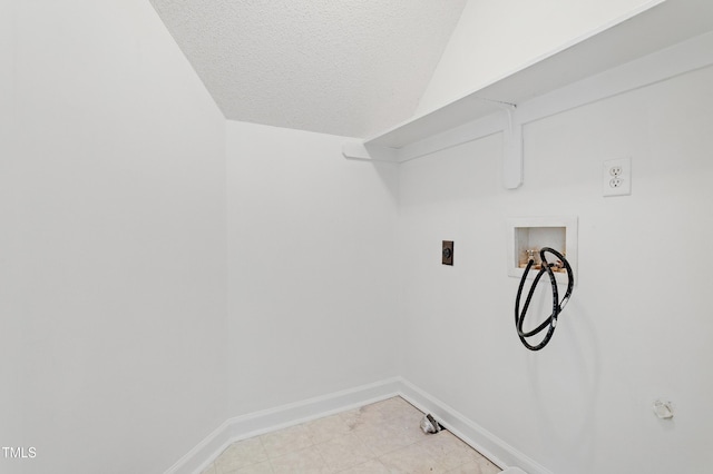 725 Littleleaf Ct, Holly Springs, NC 27540 - washroom with electric dryer hookup, washer hookup, gas dryer hookup, a textured ceiling, and light tile patterned flooring