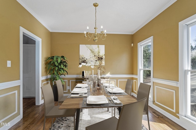 725 Littleleaf Ct, Holly Springs, NC 27540 - dining space with a chandelier, ornamental molding, wood finished floors, a wainscoted wall, and a decorative wall