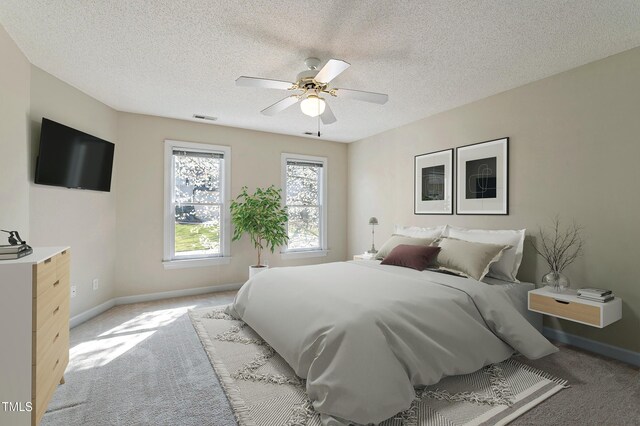 725 Littleleaf Ct, Holly Springs, NC 27540 - bedroom featuring light colored carpet, a textured ceiling, and ceiling fan