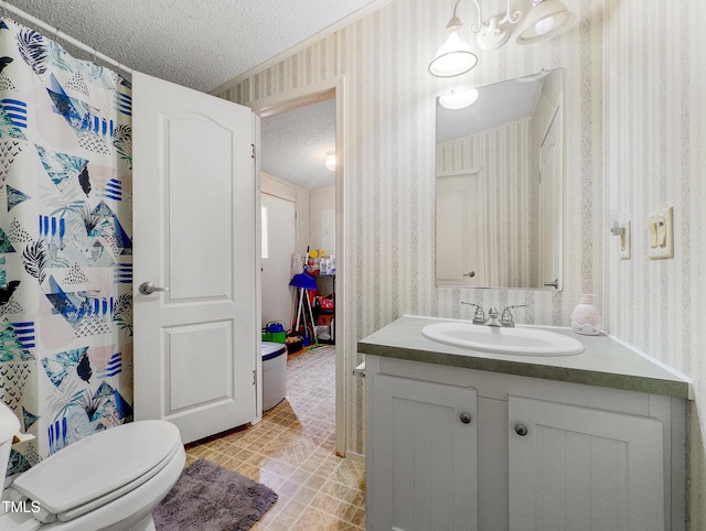 bathroom featuring a textured ceiling, toilet, vanity, and a shower with shower curtain