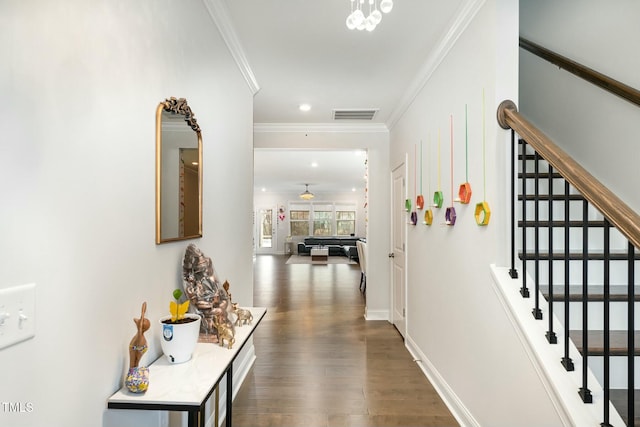 corridor with dark wood-type flooring and ornamental molding