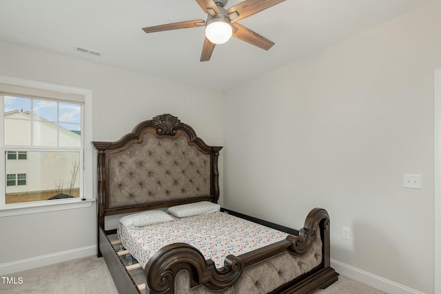 bedroom with light carpet and ceiling fan