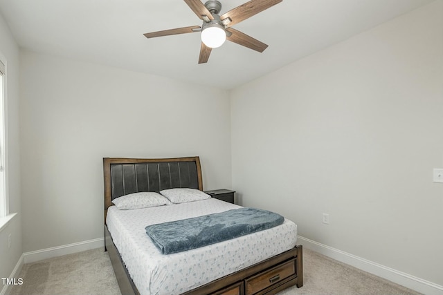 bedroom with light carpet and ceiling fan