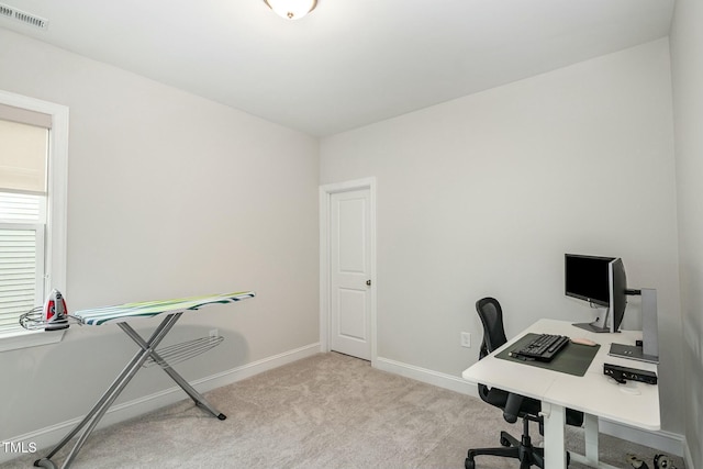 home office with light colored carpet