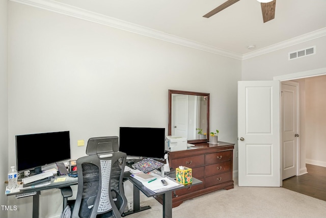 office area featuring light carpet, ornamental molding, and ceiling fan