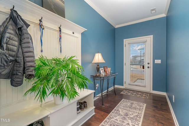 foyer entrance featuring ornamental molding and dark hardwood / wood-style floors