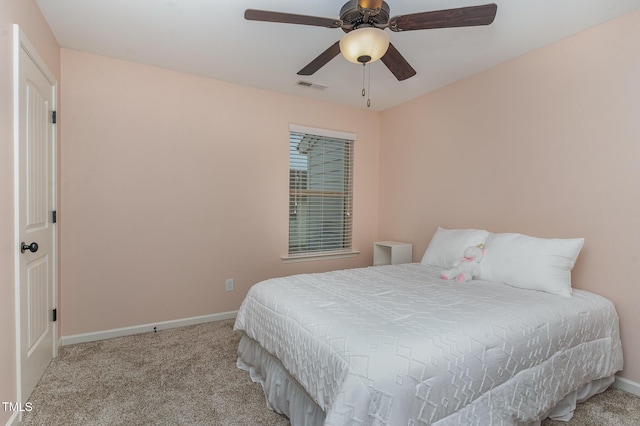 bedroom featuring light carpet and ceiling fan