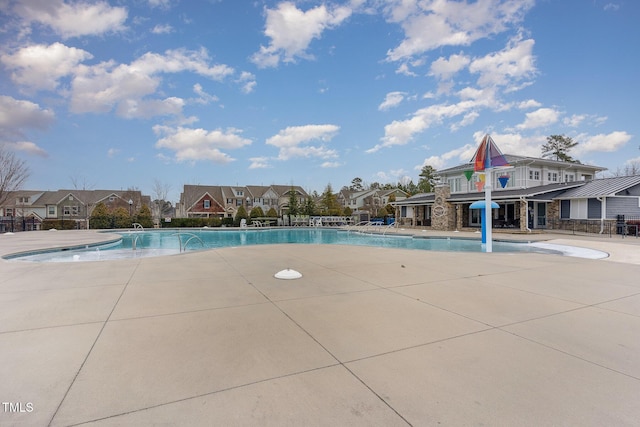 view of swimming pool featuring a patio