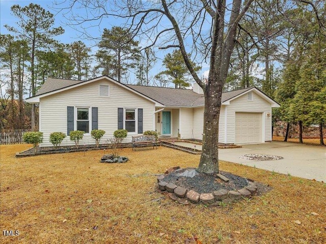 single story home featuring a garage and a front yard