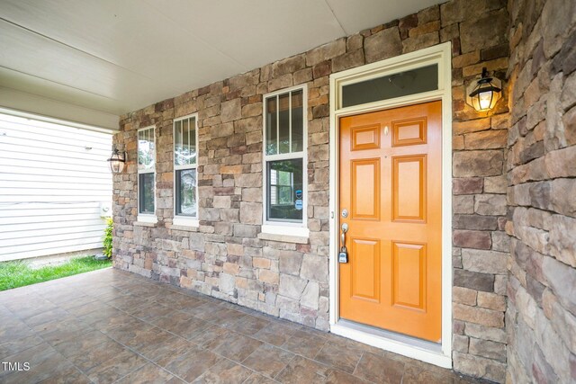 532 Front Ridge Dr, Cary, NC 27519 - property entrance featuring a porch and stone siding