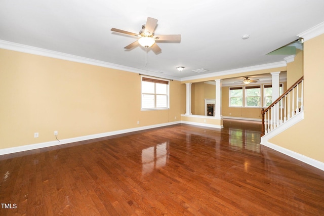 532 Front Ridge Dr, Cary, NC 27519 - unfurnished living room featuring decorative columns, a ceiling fan, ornamental molding, baseboards, and wood finished floors