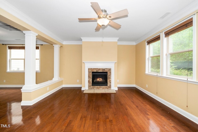 532 Front Ridge Dr, Cary, NC 27519 - unfurnished living room featuring dark wood-style flooring, decorative columns, a fireplace, and crown molding