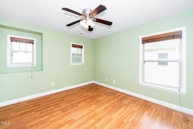 532 Front Ridge Dr, Cary, NC 27519 - unfurnished room with baseboards, light wood-style flooring, and ceiling fan