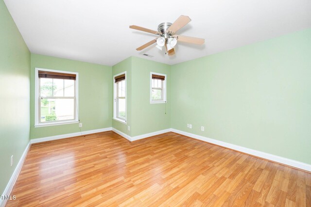 532 Front Ridge Dr, Cary, NC 27519 - spare room featuring light wood-style floors, baseboards, and a ceiling fan