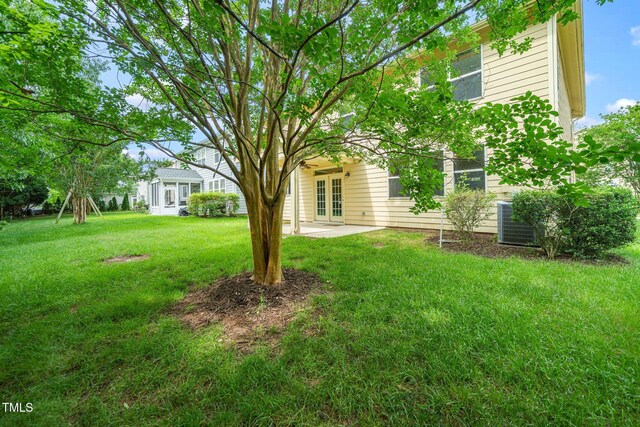 532 Front Ridge Dr, Cary, NC 27519 - view of grassy yard with a patio area, french doors, and central AC unit