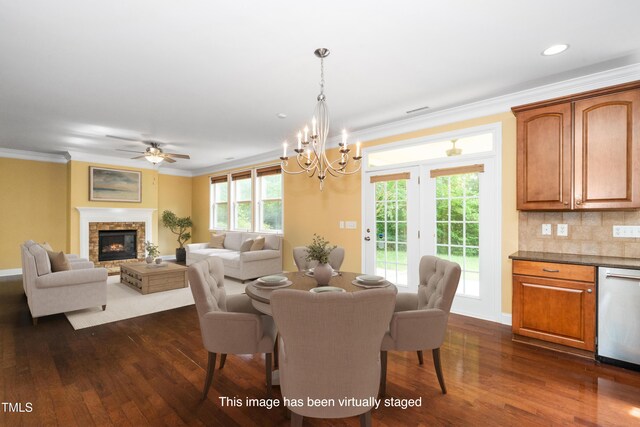 532 Front Ridge Dr, Cary, NC 27519 - dining room featuring dark wood-style flooring, ornamental molding, a chandelier, healthy amount of natural light, and recessed lighting