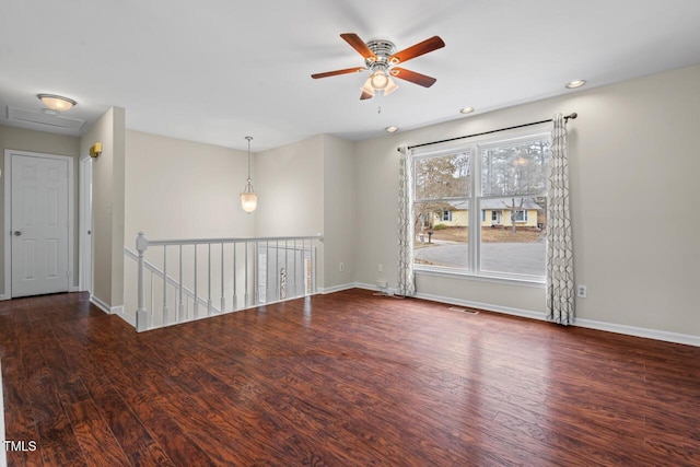 spare room featuring visible vents, baseboards, wood finished floors, and recessed lighting