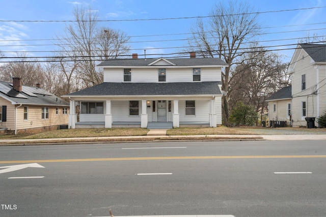 view of front of home with central AC unit and covered porch