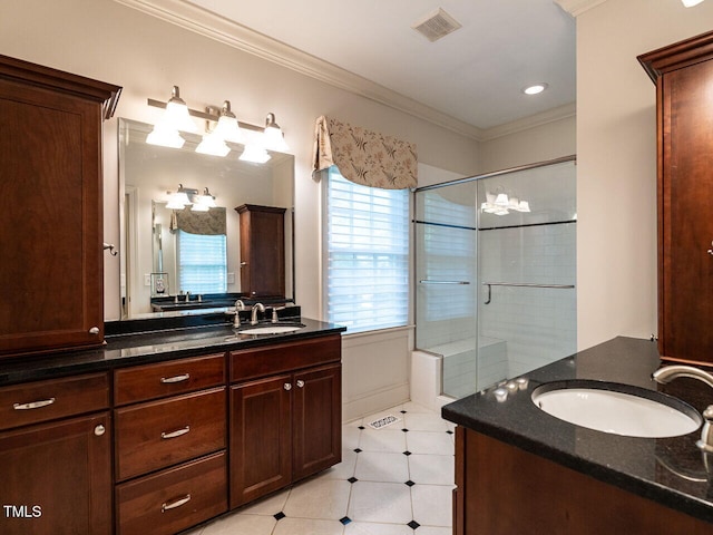 3504 Rock Creek Dr, Raleigh, NC 27609 - bathroom featuring a sink, ornamental molding, a stall shower, and visible vents