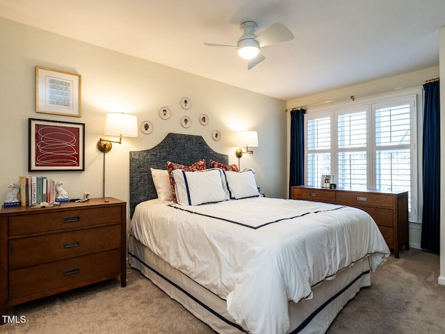 bedroom featuring ceiling fan and light colored carpet