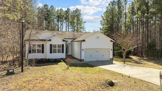 single story home with a front lawn, concrete driveway, and an attached garage