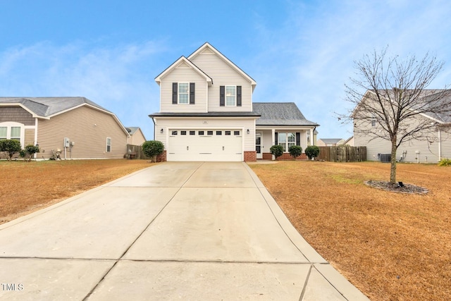 view of front property featuring a garage and a front lawn