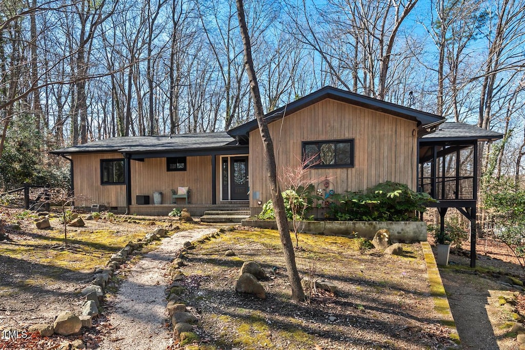 view of front of home featuring a sunroom