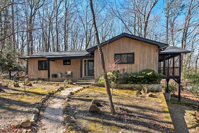 view of front of home featuring a sunroom