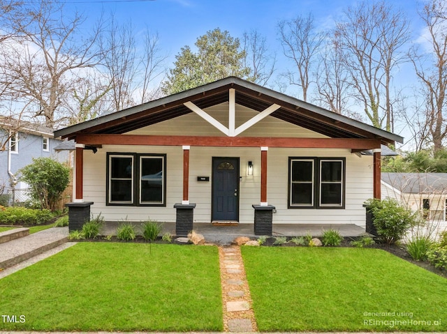 bungalow-style house featuring a front yard and a porch