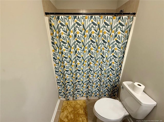 bathroom with tile patterned floors