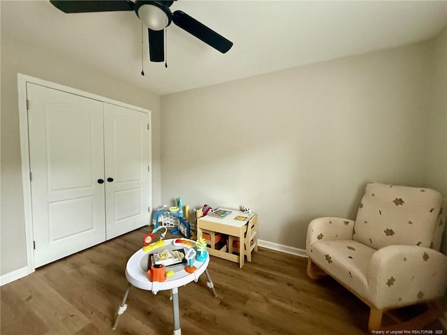 recreation room featuring hardwood / wood-style floors and ceiling fan