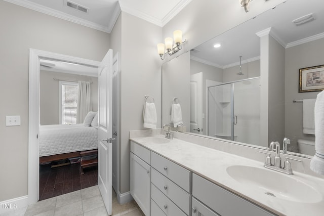 bathroom featuring crown molding, a sink, and a shower stall