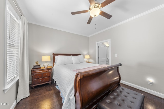 bedroom featuring crown molding, baseboards, and wood finished floors