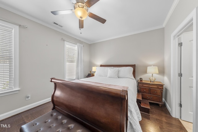 bedroom with multiple windows, visible vents, and wood finished floors