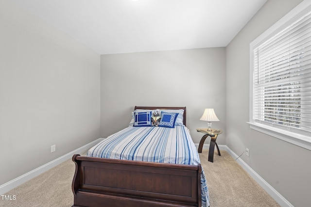 carpeted bedroom with baseboards