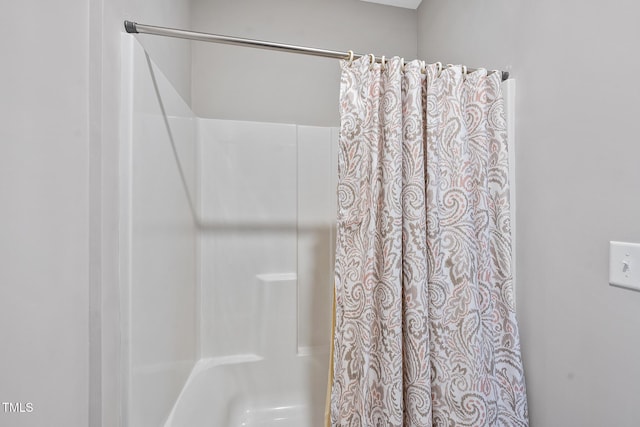 bathroom with a shower with shower curtain