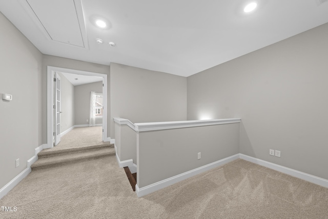 hall featuring recessed lighting, carpet floors, an upstairs landing, baseboards, and attic access