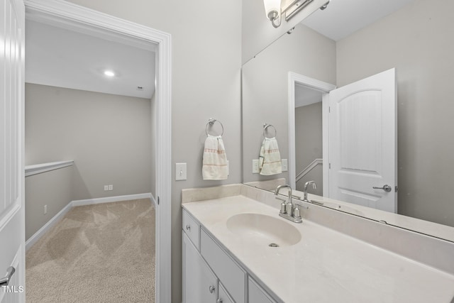 bathroom featuring vanity and baseboards