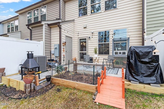 exterior space with a grill and central air condition unit