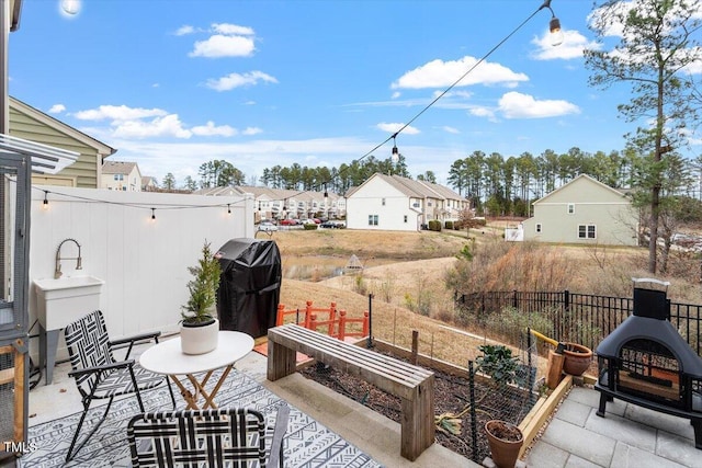 view of patio with a grill