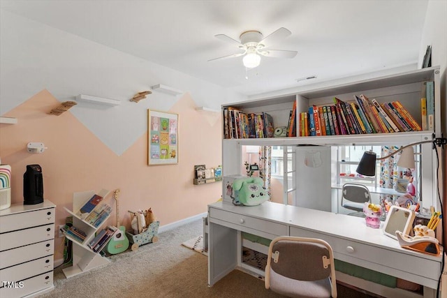 office area with ceiling fan and carpet flooring