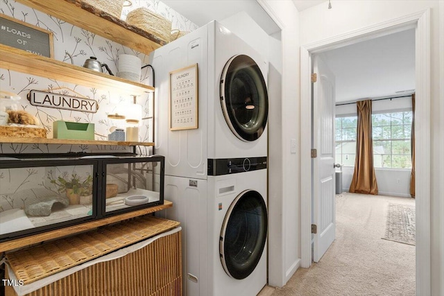 clothes washing area featuring light carpet and stacked washer and dryer