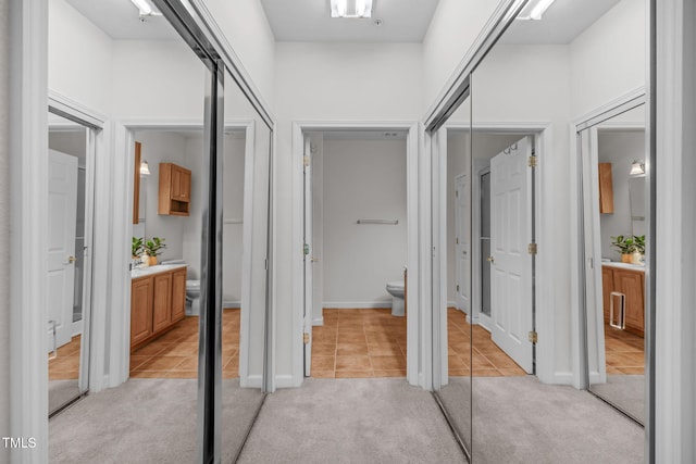 hallway with light carpet