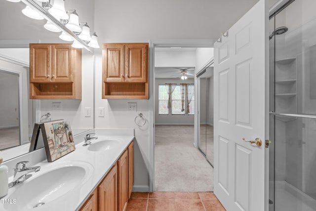 bathroom with vanity, an enclosed shower, tile patterned floors, and ceiling fan