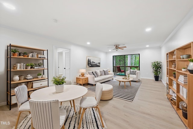 living area with baseboards, ceiling fan, ornamental molding, light wood-style floors, and recessed lighting