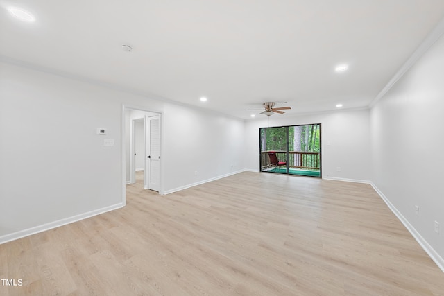 empty room featuring light wood finished floors, recessed lighting, baseboards, and ornamental molding