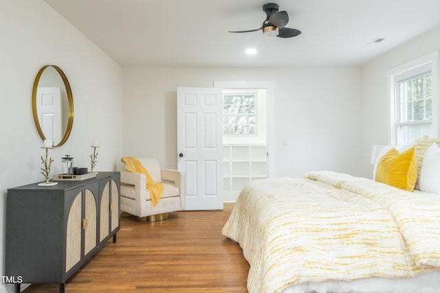 bedroom featuring dark hardwood / wood-style flooring and ceiling fan